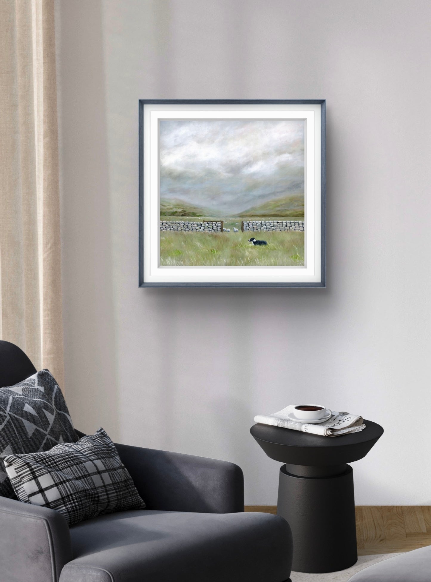 Framed artwork of a landscape with a sheep on a wall in a living room.
