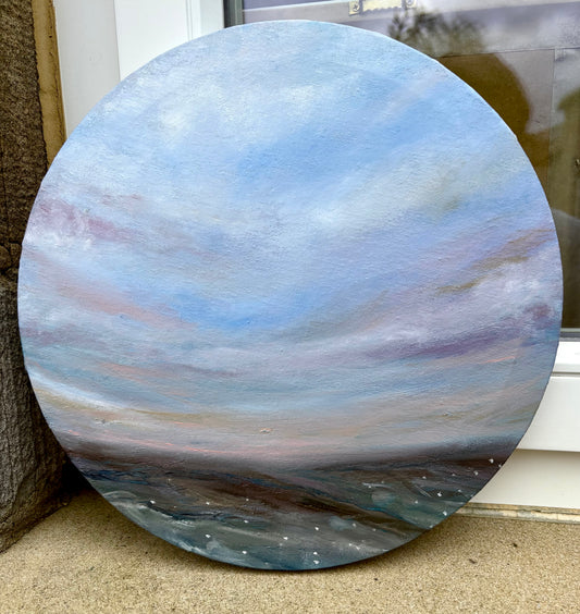 circular oil painting featuring expressive blue and purple sky against a moorland view