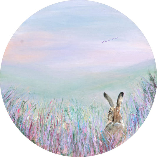 Hare in a field with a pastel sky and grass