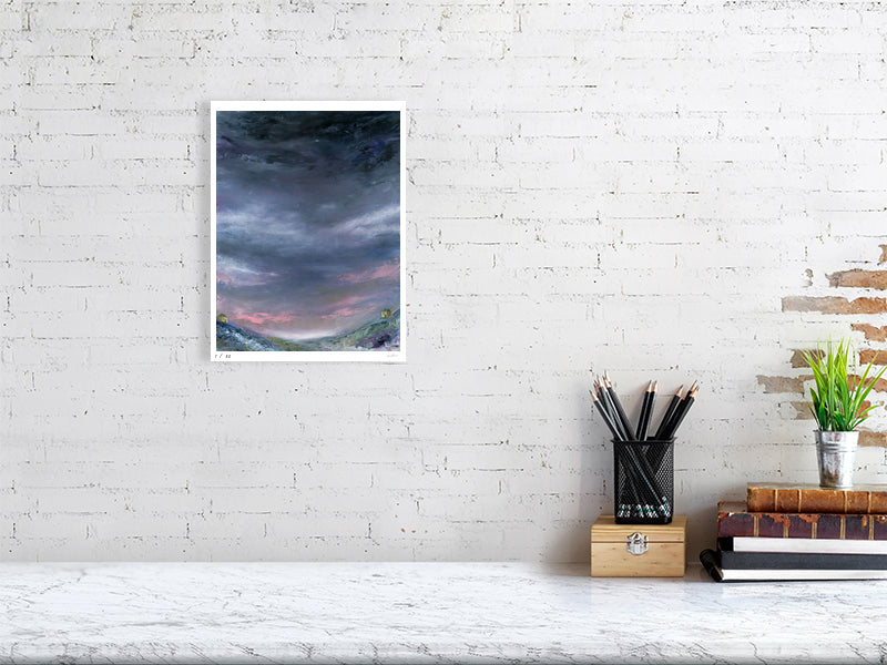 a night sky moorland landscape view art print on a desk against a cream coloured wall