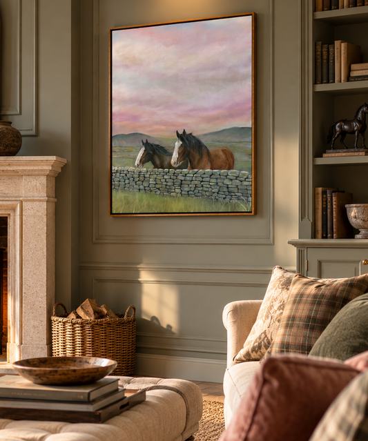 a cosy countryside living room featuring a framed canvas with two clydesdales on, a drystone wall and distant moors